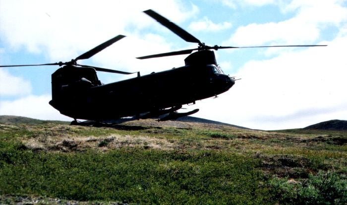 Arrival at the site - 89-00176, piloted by CW4 Morgan (PC), Captain Magness (PI), and crewed by SGT Wainwright (FE) and SPC Jorgensen (CE), on the hill just above Icky.