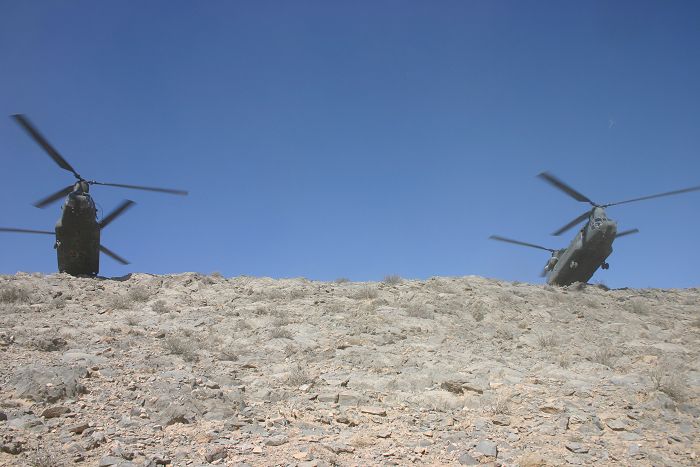 On a mission south of Kandahar, Afghanistan, two CH-47D Chinook helicopters assigned to Company G, 104th Aviation, Army National Guard, from the States of Connecticut and Pennsylvania, conduct an extraction (EXFIL) of soldiers involved in the Hunt For Osama.