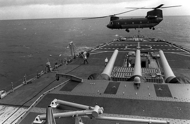 The Boeing CH-47 Chinook helicopter with one of the Big ships from World War Two.