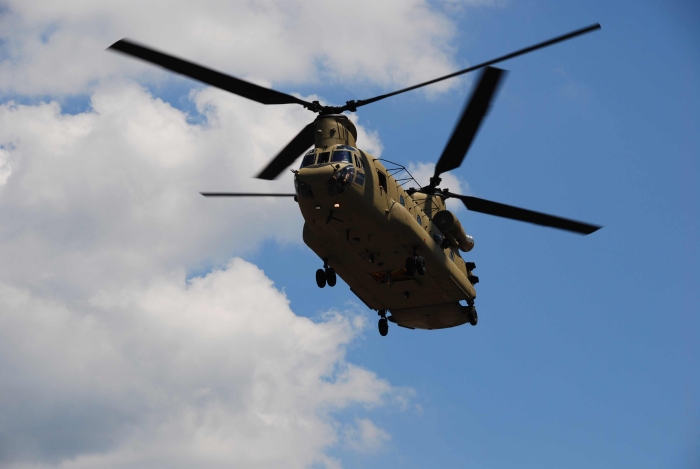 A new CH-47F model Chinook helicopter, tail number unknown, prepares to land in the Von Braun Center parking lot for the annual Cargo Helicopter Users conference.