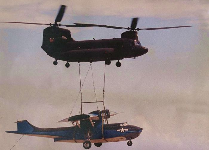 A PBY lift by a Singapore BV-234 Chinook in Texas. Warrant Officer Tim McCall was one of the pilots of the CH-47D transporting the Catalina.