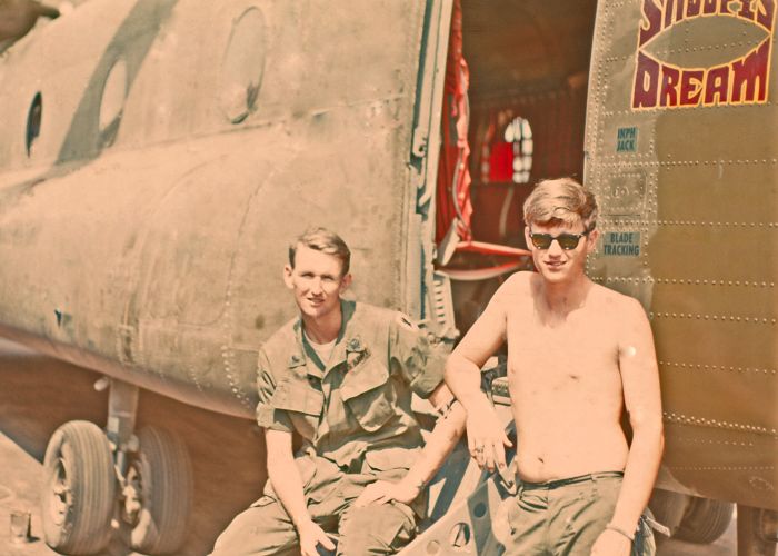 65-07981 pictured with crew members SP5 Tom Hope (left), FE, and SP5 David Stroud (right), CE, 1971.