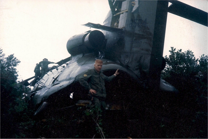 10 January 1970: CH-47C Chinook helicopter 67-18524 while assigned to A Company - "Pachyderms", 159th Assault Support Helicopter Battalion (ASHB), 101 Airborne Division in the Republic of Vietnam. The aircraft accident occurred just outside the wire at Camp Evans. The aircraft had just refueled and left the POL (Petroleum, Oil, Lubricant) point when it suffered from near simultaneous dual engine failures. In the photo is SP6 Loren J. Holloway, chief Technical Inspector in the company at the time. He removed the fuel lines at the engines for inspection and discovered both were severely contaminated with water and what appeared to be seaweed.