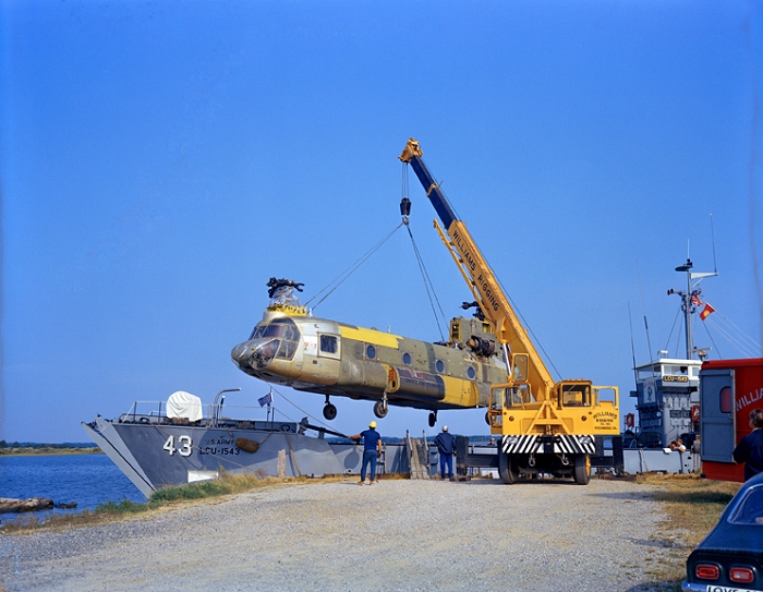 1973: A crane offloads CH-47C Chinook helicopter 67-18542 from a barge. The aircraft was transported from Fort Eustis, Virgina, and was destined for destruction as part of the crash testing conducted in support of the U.S. Army by the National Aeronautics and Space Administration (NASA).