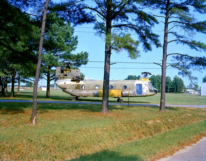 1973: CH-47C Chinook helicopter 67-18542 parked in the grass during the move to Langley Air Force Base, Virginia. The aircraft was transported from Fort Eustis, Virgina, and was destined for destruction as part of the crash testing conducted in support of the U.S. Army by the National Aeronautics and Space Administration (NASA).