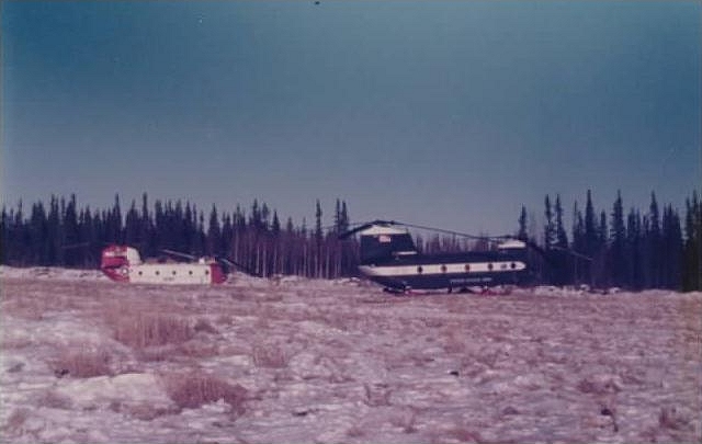 On the right, CH-47C Chinook helicopter 71-20949 in the cold of Alaska.