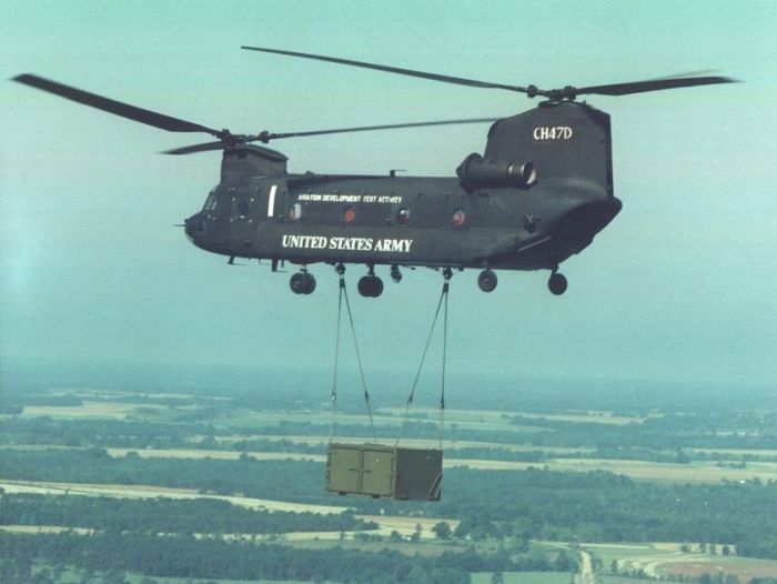81-23383, as Bearcat 1, performing sling load tests of new airmobile containers an unknown company was trying to sell to the U.S. Army.