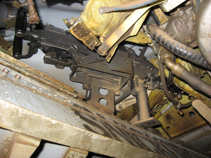 A view of the ramp area of 83-24123 showing the M-240 machine gun pinned under the aft transmission after it was taxied into another aircraft at Bagram, Afghanistan, on 10 August 2007.