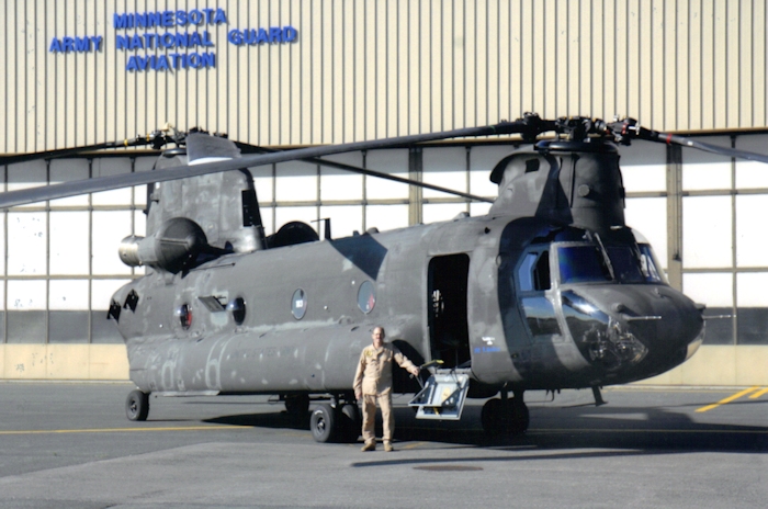 June 2008: SSG Jeffrey L. Stokes, Flight Engineer,  stands beside Chinook helicopter 84-24183 at the Minnesota National Guard Base, St, Paul, Minnesota.