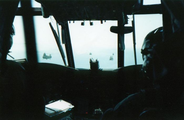 Somewhere in Saudi Arabia, during Operation Desert Storm, then CW2 Harry Champagne looked out the window of 85-24335. Say, what was that in his mouth?