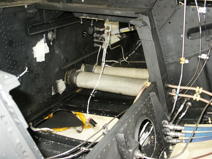 The right chin bubble area of CH-47D Chinook helicopter 85-24336 showing the area under the pilots seats and the heater ducts.