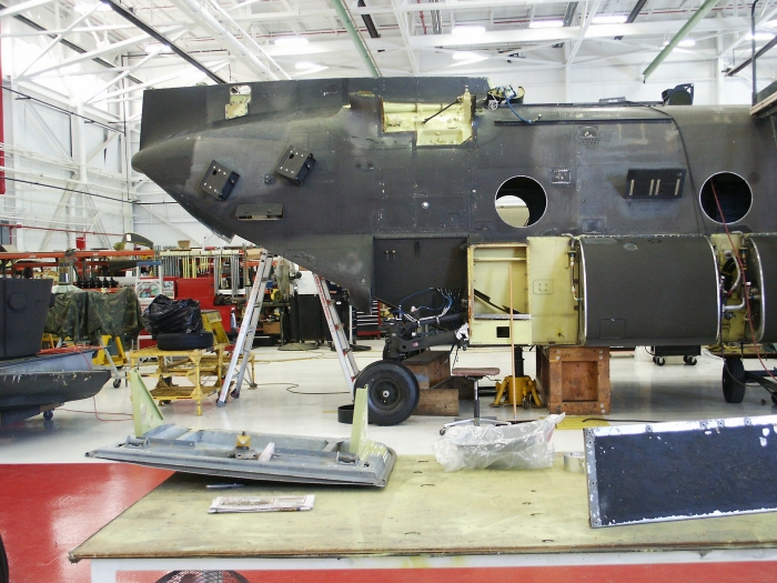 The right exterior area of CH-47D Chinook helicopter 85-24336 showing the right aft landing gear.
