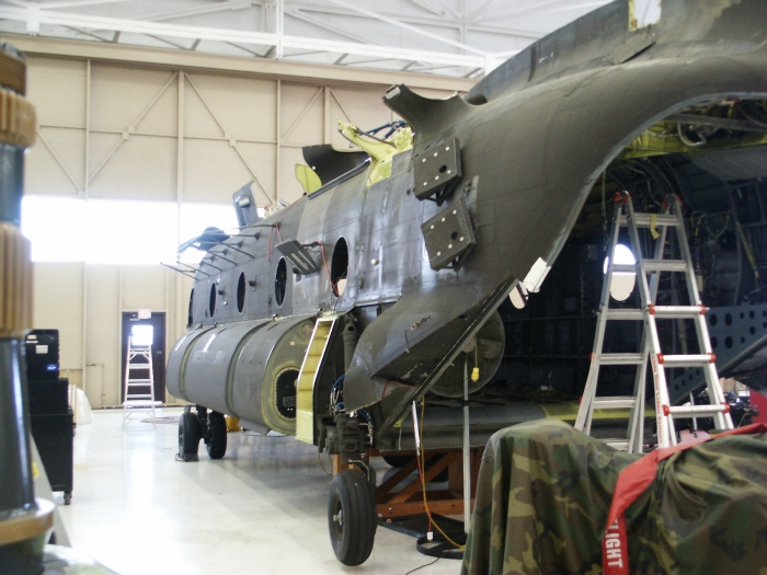 The left aft exterior area of CH-47D Chinook helicopter 85-24336 showing the flare and chaff dispenser payload module mounts.