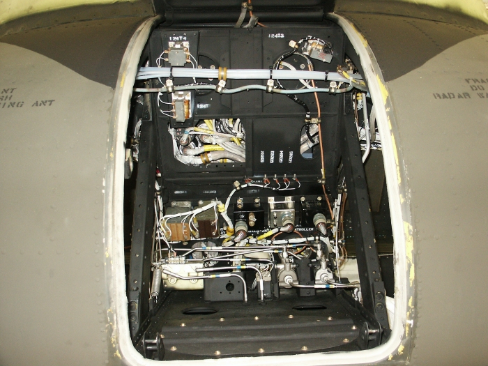 Inside the nose compartment of CH-47D Chinook helicopter 85-24336 with the nose vibration absorber removed showing the brake transfer valves.