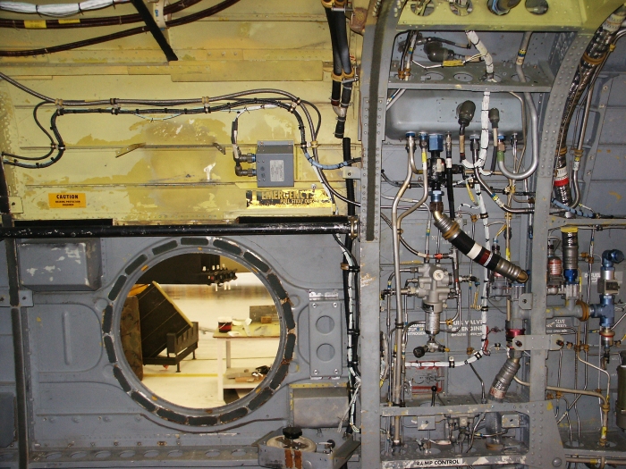 The right inside ramp area of CH-47D Chinook helicopter 85-24336 showing the number two engine RDPS (just forward of station 482 - the large bulkhead in the center), the power steering accumulator and the fuel and hydraulic lines going to the number two engine.