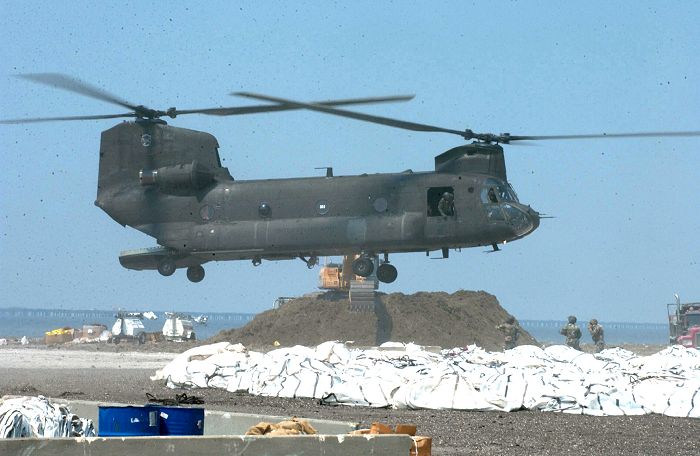 Chinook helicopter 85-24335 delivers sand bags to shore up the levees surrounding New Orleans.