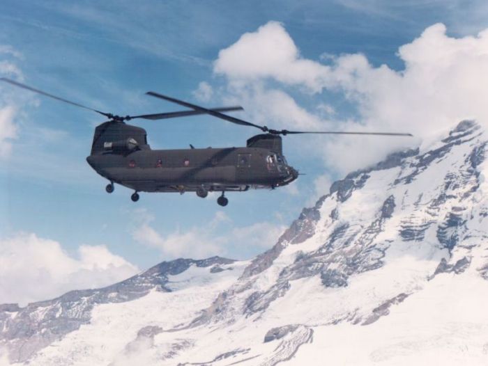 A Boeing CH-47D helicopter cruises the Washington state wilderness.