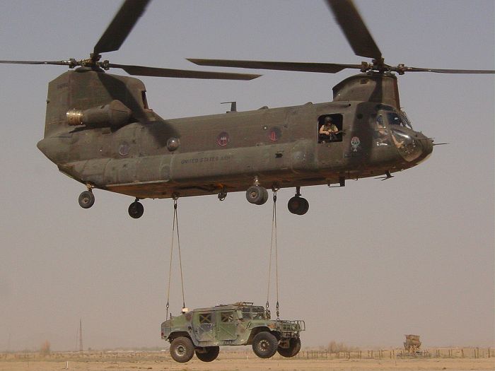 86-01666 transporting a High Mobility Multi-purpose Wheeled Vehicle (HMMV) in Afghanistan, circa 2003.