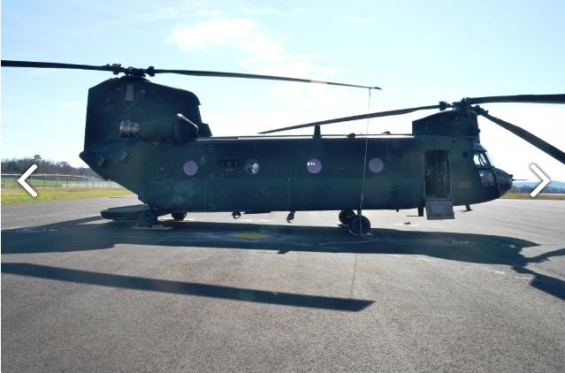 A right side view of CH-47D Chinook helicopter 88-00097 sitting at Madison Executive Airport (KMDQ), Meridianville, Alabama, during the auction process as it went up for sale to the highest bidder on the commercial market.