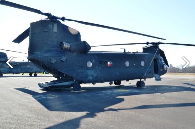 A right rear view of CH-47D Chinook helicopter 88-00097 sitting at Madison Executive Airport (KMDQ), Meridianville, Alabama, during the auction process as it went up for sale to the highest bidder on the commercial market.