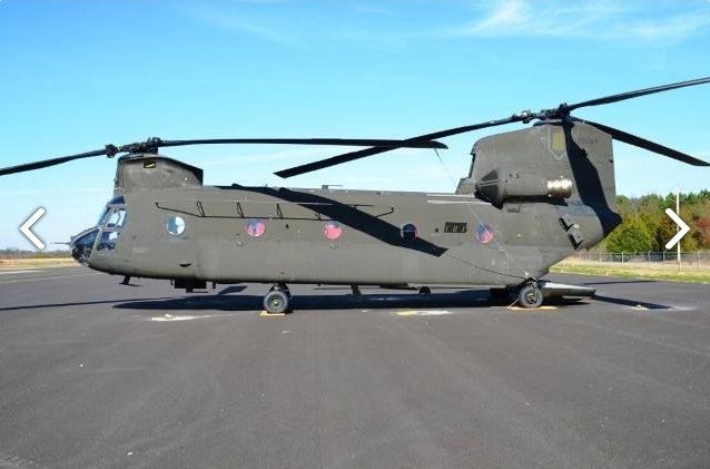 A left side view of CH-47D Chinook helicopter 88-00097 sitting at Madison Executive Airport (KMDQ), Meridianville, Alabama, during the auction process as it went up for sale to the highest bidder on the commercial market.