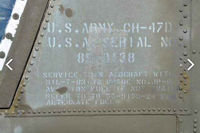 The identifying information painted on the side of CH-47D Chinook helicopter 89-00138 just aft of the left pilot's door as it sat at Madison Executive Airport (KMDQ), Meridianville, Alabama, during the auction process as it went up for sale to the highest bidder on the commercial market.