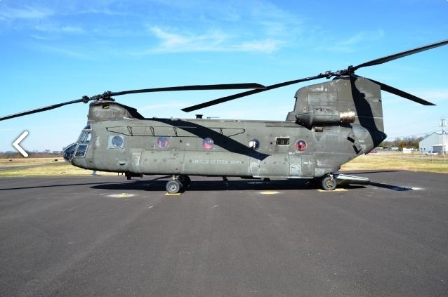 A left side view of CH-47D Chinook helicopter 89-00138 as it sat at Madison Executive Airport (KMDQ), Meridianville, Alabama, during the auction process as it went up for sale to the highest bidder on the commercial market.