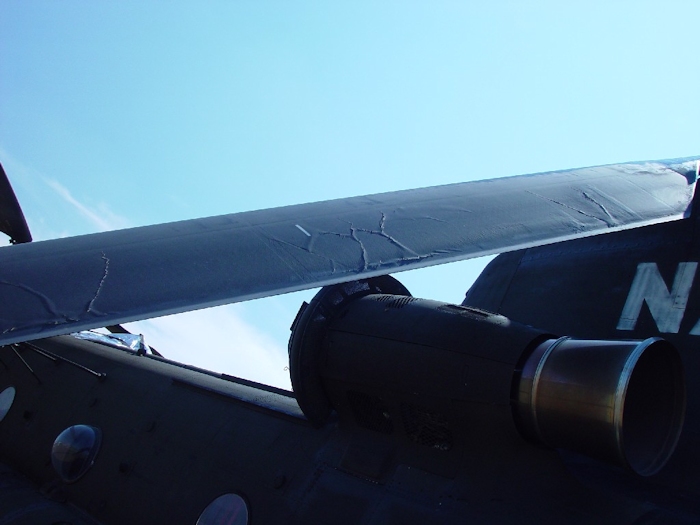 July 2002: This photograph shows extensive damage to an aft rotor blade. There are cracks and tears in the structure of the blade.