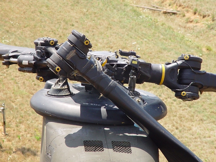 July 2002: Without the droop stops engaged and the dampner firmly attached, an aft rotor blade will make contact with the fuselage during engine shutdown and cause extensive damage.