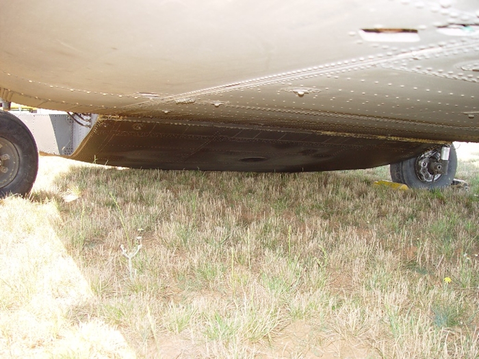 July 2002: A view of the underside of the ramp as it rests on the ground. It is normal for the ramp to be in contact with the ground once the aircraft is shutdown. Should the ramp contact the ground during flight operations, severe damage may be done to the structure of the aircraft.