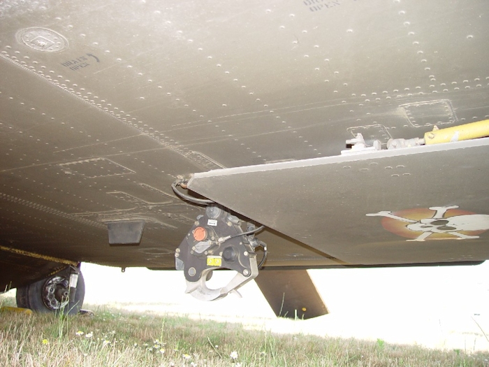 July 2002: A view of the aft cargo hook and lower rescue door. Flight Engineers often place distinctive markings on thier aircraft. Here the lower rescue door has the Skull and Bones painted on it making it an easily recognizable aircraft when it comes in to pick up a sling load.