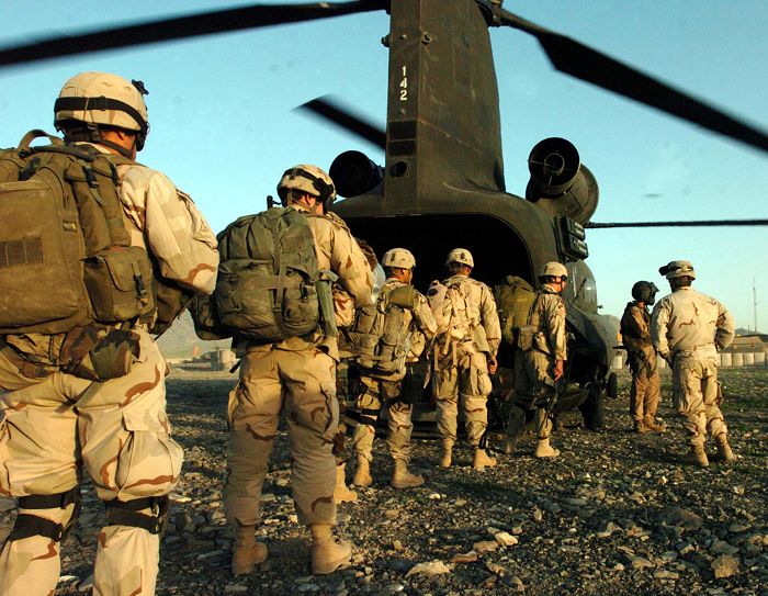 Soldiers from 1st Battalion, 508th Infantry Regiment, 82nd Airborne Division, board a CH-47 Chinook helicopter for a counterinsurgency operation near Mangritae, Afghanistan.