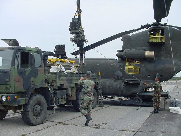 The defective transmission is placed on the transport stand in the cargo area of an LMTV for the trip back to Fort Wainwright.