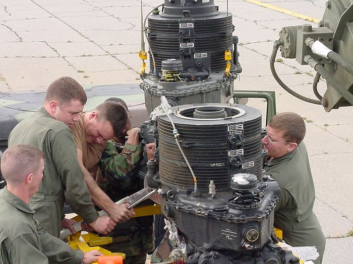 Some required parts are removed from the old transmission to be utilized on the new one.