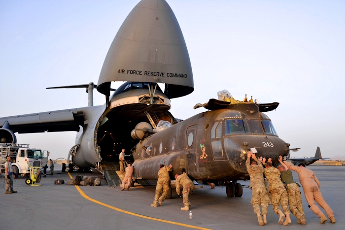 20 April 2013: U.S. Army National Guard soldiers push CH-47D Chinook helicopter 91-00243 into a U.S. Air Force C-5 Galaxy as they prepare to return home to the United States following a nine-month deployment to Afghanistan. The soldiers are assigned to Detachment 1, Company B, 3rd Battalion 126th Aviation (Heavy Lift) located in Rochester, New York.