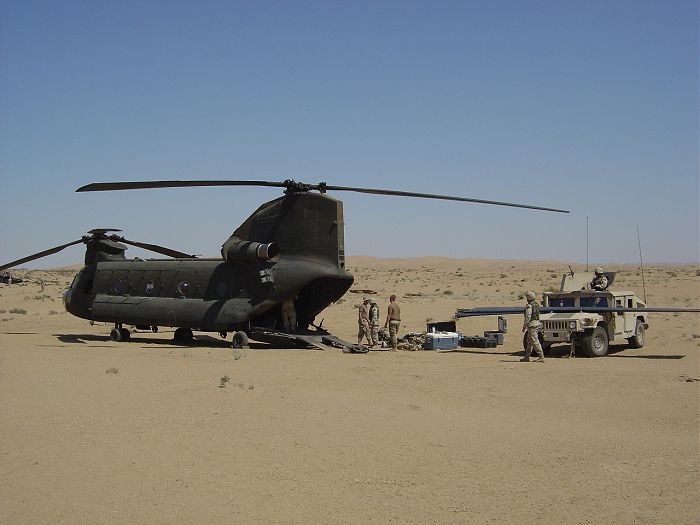 93-00928 assisting with the recovery of a downed UH-60 Blackhawk helicopter in the desert of Iraq.