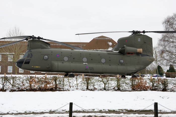 25 January 2013: In a photograph provided by Mike Hopwood CH-47F (minus) Chinook helicopter 03-08003 is seen in Royal Air Force livery standing guard at the gate of RAF Odiham, England, on permanent static display.