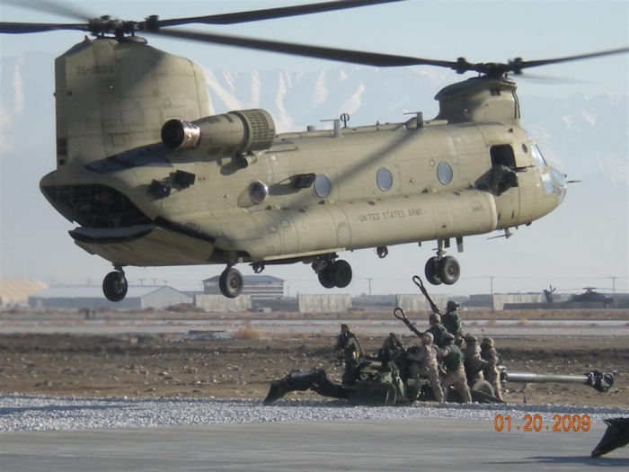 Early 2009: CH-47F Chinook helicopter 05-08016 preparing to sling load a M-777 155mm Howitzer in Afghanistan.