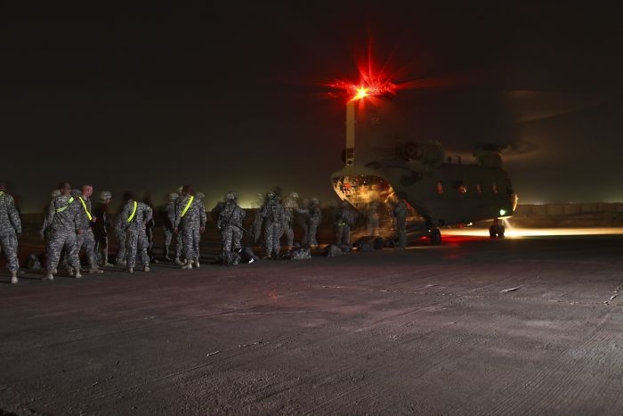 20 May 2009. CAMP TAJI, Iraq: Under the cover of night, Soldiers from the 1st Air Cavalry Brigade, 1st Cavalry Division, Multi-National Division - Baghdad, arrive at Camp Taji, Iraq for their year-long deployment in support of Operation Iraqi Freedom. Soldiers flew in on a CH-47F Chinook helicopter assigned to Company B, 2nd Battalion, 4th Aviation Regiment, Combat Aviation Brigade, 4th Infantry Division, home stationed at Fort Hood, Texas.