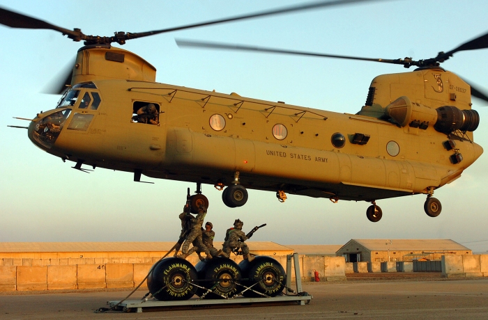 10 February 2011, CAMP TAJI, Iraq - Soldiers from 1st Air Cavalry Brigade, 1st Cavalry Division, U.S. Division-Center, and the 3rd Infantry Division attach three fuel blivets to "Blackcats" CH-47F Chinook helicopter 07-08037 for a sling load mission. The blivets were being transported to an Iraqi outpost called Obeidi near the Syrian border to establish a temporary Forward Arming and Refueling Point (FARP) for Air Cav aircraft involved in operations in the area.