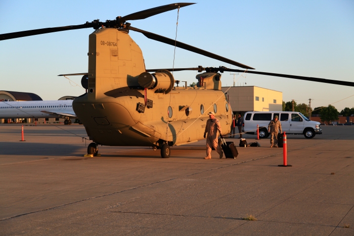 11 April 2012: Rob Simpson, Flight Engineer (foreground) and copilot CW4 Sean Barcoe arrive at sunrise at the Spirit of St. Louis Airport to prep 08-08764 for flight.