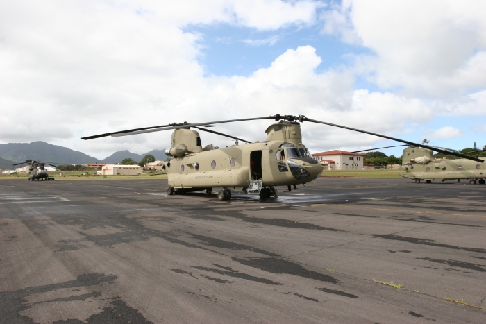 8 December 2011: CH-47F Chinook helicopter 08-08766 rests on the Army National Guard ramp at Wheeler Army Airfield, Oahu, Hawaii. In the left background can be seen an older D model version of the Chinook helicopter, tail number 91-00256. Also in the background is Kolekole Pass which provides for air and ground transit to the west side of the island. 08-08766 was transferred to Company B - "Voyagers", 171st Aviation, in late November and utilized by members of the S3 Incorporated New Equipment Training Team (NETT) to support the aircraft qualification of unit aircrew members.