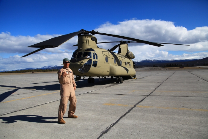 18 April 2012: Flight Engineer Andrew "Manny" Manuel, native of Hawaii, poses for a shot in front of 08-08771 on the ramp at Whitehorse Airport, Yukon Territory, on a bright and shiny, but chilly day. A push was made to continue all the way to Ladd Field from Fort Nelson in one day.