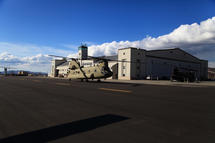 19 April 2012: CH-47F Chinook helicopter 08-08774 taxies past historic Hangar 1 upon its arrival at Ladd field, Fort Wainwright, Alaska.