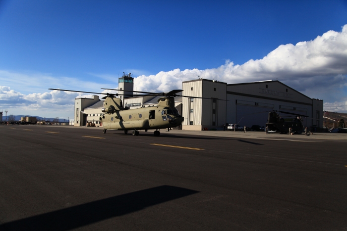 19 April 2012: CH-47F Chinook helicopter 08-08775 taxies past historic Hangar 1 upon its arrival at Ladd field, Fort Wainwright, Alaska.