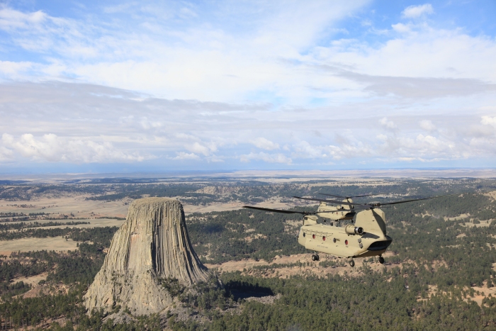 13 April 2012: CH-47F Chinook helicopter 08-08775 and 08-08772 are photographed from 08-08774 passing Devils Tower in Wyoming.
