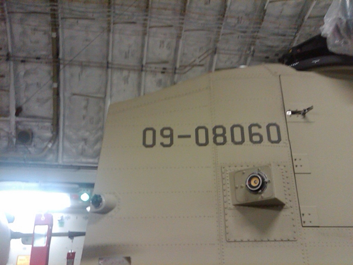 The Aft Pylon of CH-47F Chinook helicopter 09-08060 gets loaded about a C-17 aircraft for deployment ot Afghanistan.