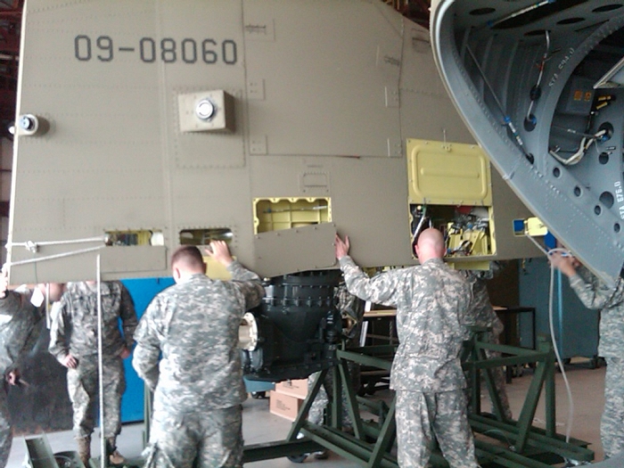 In preparation for Stategic Air Deployment (STRATAIR) to Afghanistan, the Aft Pylon of CH-47F Chinook helicopter 09-08060 gets removed.