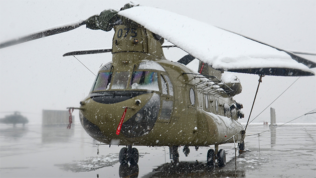 6 February 2014: Snow covers 10-08075, a Task Force Thunder, 159th Combat Aviation Brigade, 101st Airborne Division (Air Assault), CH-47F Chinook Helicopter at Bagram Air Field, Afghanistan.