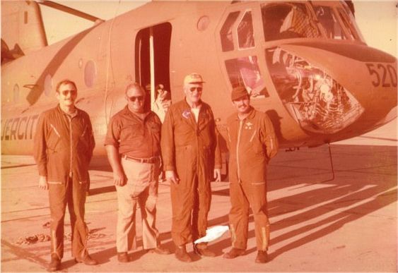 A group photograph of AE-520 and the crew . Left to right is: ??? Mussante (Argentine Army Pilot), Glenn Miller (Boeing Mechanic), William Coffee (Boeing Instructor Pilot), Pedro Angel Obregn (Argentine Army Pilot). Date unknown.